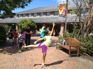 One YAP student shows off her arabesque between classes outside of the Olin Arts Center.